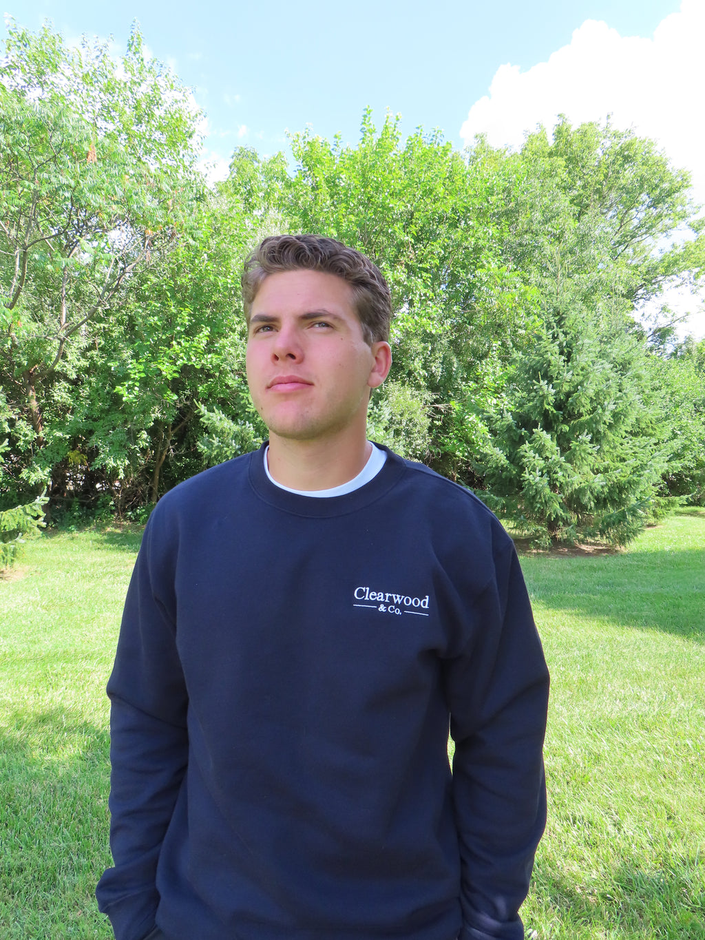Clearwood & Co. classic crewneck sweatshirt in navy, worn