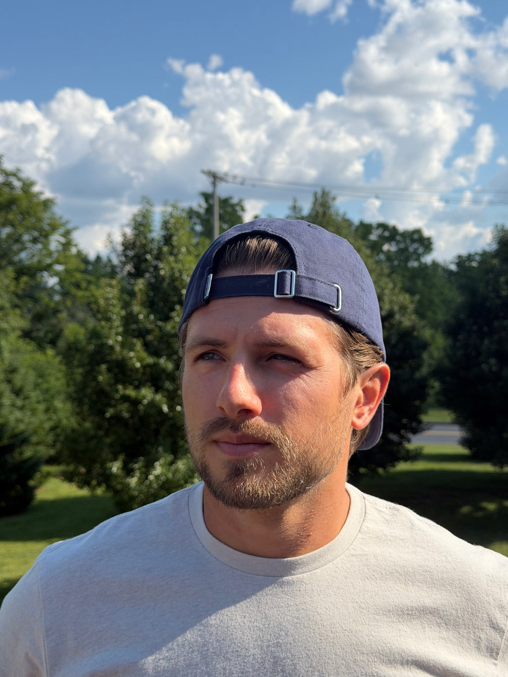 Clearwood & Co. buckle dad hat in navy, side view